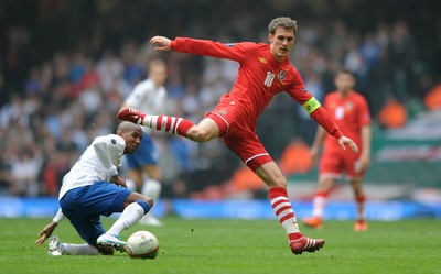 26.03.11 - Wales v England - Euro 2012 Qualifier - Aaron Ramsey of Wales is tackled by Ashley Young of England. 