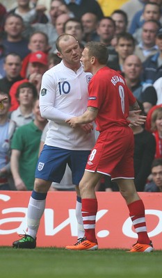 26.03.11 - Wales v England, UEFA Euro 2012 Qualifier -  Wales' Craig Bellamy clashes with Wayne Rooney.
©Huw Evans Agency