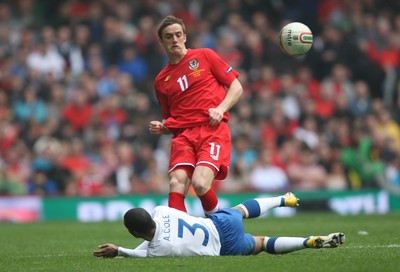 26.03.11 - Wales v England, UEFA Euro 2012 Qualifier -  Wales' Andy King plays the ball past England's Ashley Cole  