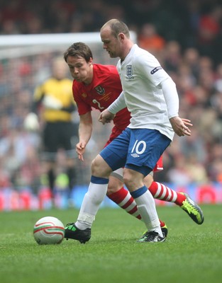 26.03.11 - Wales v England, UEFA Euro 2012 Qualifier -  England's Wayne Rooney holds off Wales' Chris Gunter  