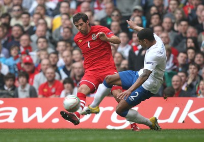 26.03.11 - Wales v England, UEFA Euro 2012 Qualifier -  Wales' Joe Ledley is challenged by England's Glen Johnson  