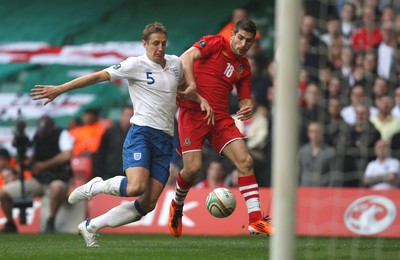 26.03.11 - Wales v England, UEFA Euro 2012 Qualifier -  Wales' Ched Evans and England's Scott Parker compete for the ball 