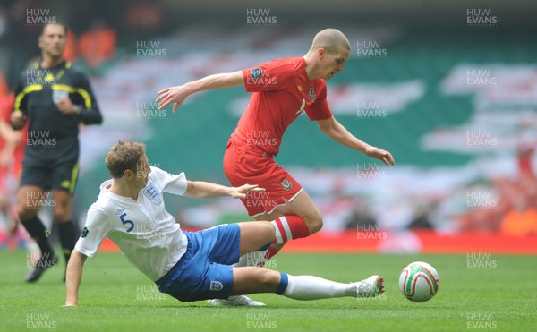 26.03.11 - Wales v England - Euro 2012 Qualifier - Steve Morison of Wales is tackled by Michael Dawson of England. 