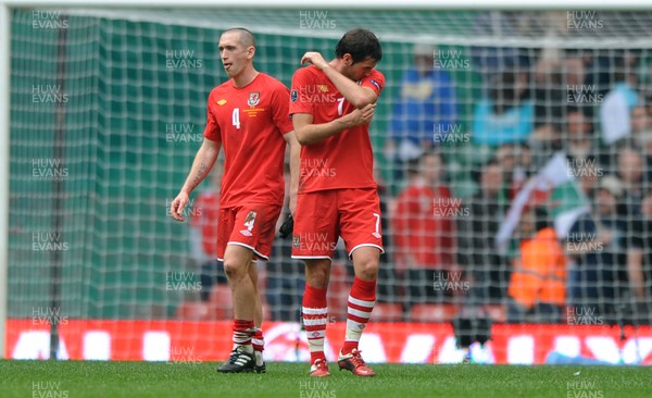 26.03.11 - Wales v England - Euro 2012 Qualifier - Andrew Crofts and Joe Ledley of Wales look dejected at the end of the game. 