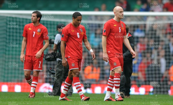 26.03.11 - Wales v England - Euro 2012 Qualifier - Joe Ledley, Ashley Williams and James Collins of Wales look dejected at the end of the game. 