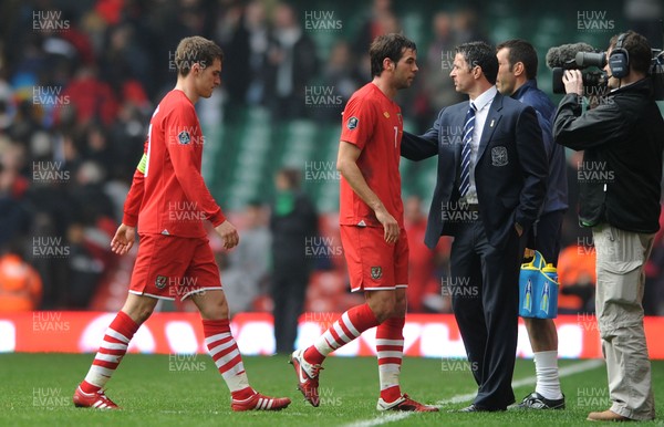 26.03.11 - Wales v England - Euro 2012 Qualifier - Aaron Ramsey and Joe Ledley of Wales look dejected with manager Gary Speed at the end of the game. 