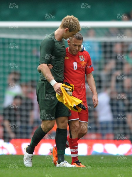 26.03.11 - Wales v England - Euro 2012 Qualifier - Joe Hart of England consoles Craig Bellamy of Wales at the end of the game. 