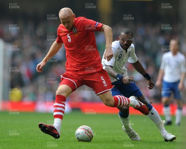 26.03.11 - Wales v England - Euro 2012 Qualifier - James Collins of Wales is challenged by Darren Bent of England. 