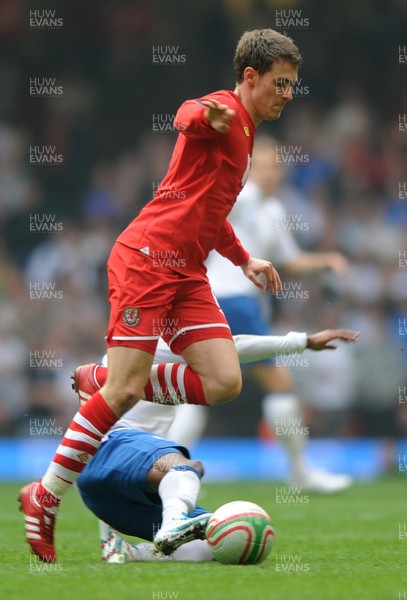 26.03.11 - Wales v England - Euro 2012 Qualifier - Aaron Ramsey of Wales is tackled by Ashley Young of England. 