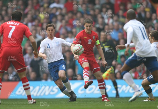 26.03.11 - Wales v England, UEFA Euro 2012 Qualifier -  Wales' Aaron Ramsey is challenged by England's Scott Parker  