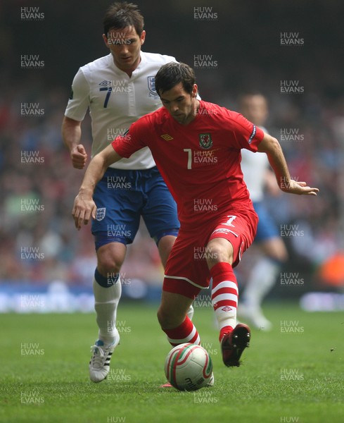 26.03.11 - Wales v England, UEFA Euro 2012 Qualifier -  Wales' Joe Ledley holds off England's Frank Lampard  