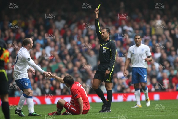 26.03.11 - Wales v England, UEFA Euro 2012 Qualifier -  England's Wayne Rooney is shown yellow card 