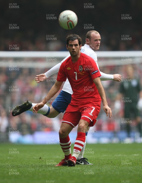26.03.11 - Wales v England, UEFA Euro 2012 Qualifier -  Wales' Joe Ledley  gets the better of England's Wayne Rooney  