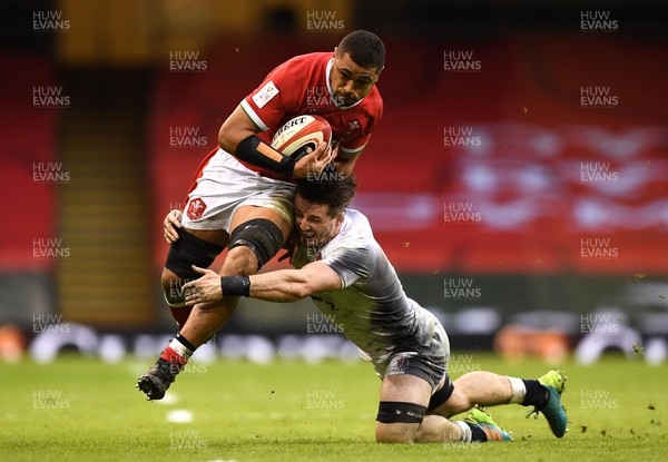 270221 - Wales v England - Guinness Six Nations - Taulupe Faletau of Wales is tackled by Tom Curry of England