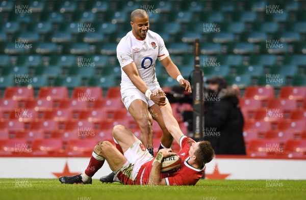 270221 - Wales v England - Guinness Six Nations - Liam Williams of Wales is helped by by Anthony Watson of England