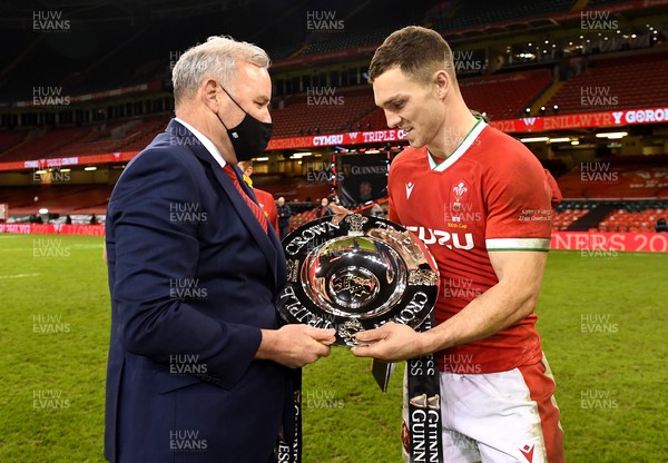 270221 - Wales v England - Guinness Six Nations - Wales head coach Wayne Pivac and George North of Wales with the triple crown trophy at the end of the game
