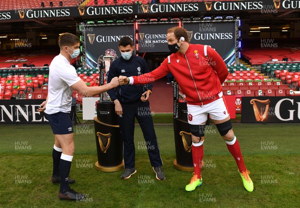 270221 - Wales v England - Guinness Six Nations - Owen Farrell of England, Referee Pascal Gauzere and Alun Wyn Jones of Wales during the coin toss