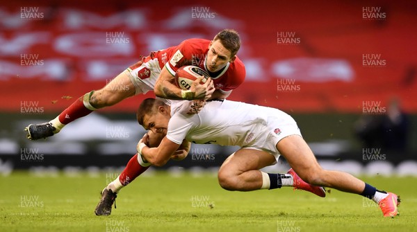 270221 - Wales v England - Guinness Six Nations - Liam Williams of Wales is tackled by Henry Slade of England