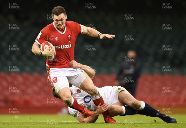 270221 - Wales v England - Guinness Six Nations - George North of Wales is tackled by Owen Farrell of England