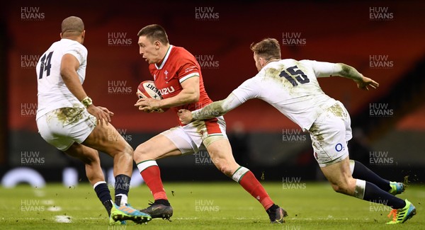 270221 - Wales v England - Guinness Six Nations - Josh Adams of Wales gets past Anthony Watson and Elliot Daly of England