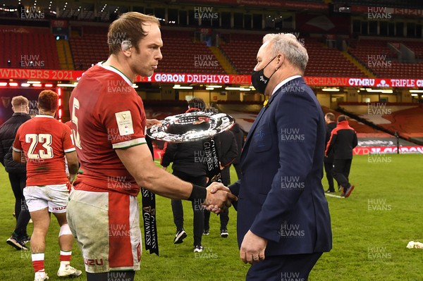 270221 - Wales v England - Guinness Six Nations - Alun Wyn Jones of Wales and Wales head coach Wayne Pivac celebrate with the triple crown trophy