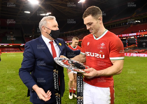 270221 - Wales v England - Guinness Six Nations - Wales head coach Wayne Pivac and George North of Wales celebrate with the triple crown
