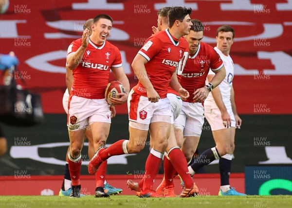 270221 - Wales v England - Guinness 6 Nations - Josh Adams of Wales celebrates scoring a try with team mates