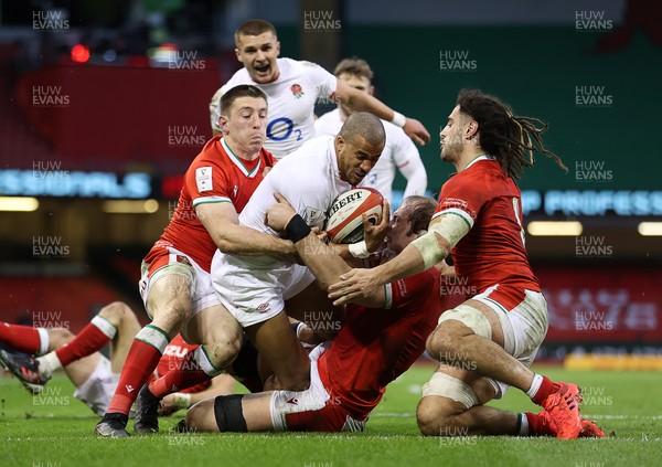 270221 - Wales v England - Guinness 6 Nations - Anthony Watson of England can�t be stopped by Josh Adams and Alun Wyn Jones of Wales to score a try