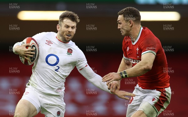 270221 - Wales v England - Guinness 6 Nations - Elliot Daly of England is tackled by George North of Wales