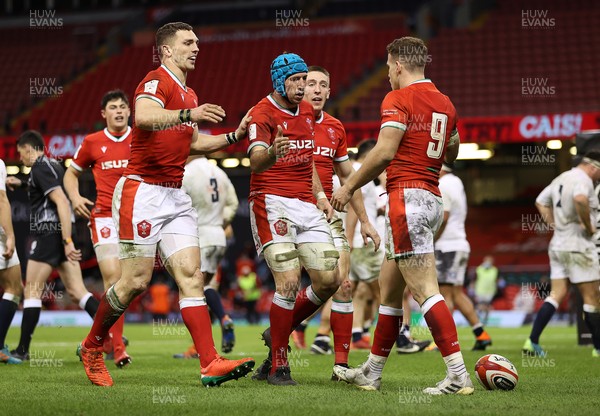 270221 - Wales v England - Guinness 6 Nations - Kieran Hardy of Wales celebrates scoring a try with team mates