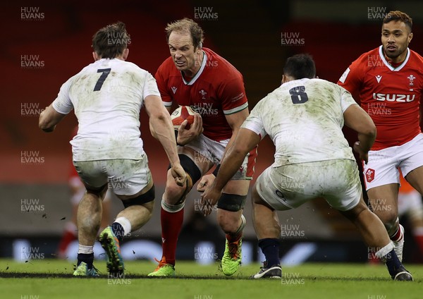 270221 - Wales v England - Guinness 6 Nations - Alun Wyn Jones of Wales is tackled by Tom Curry and Billy Vunipola of England