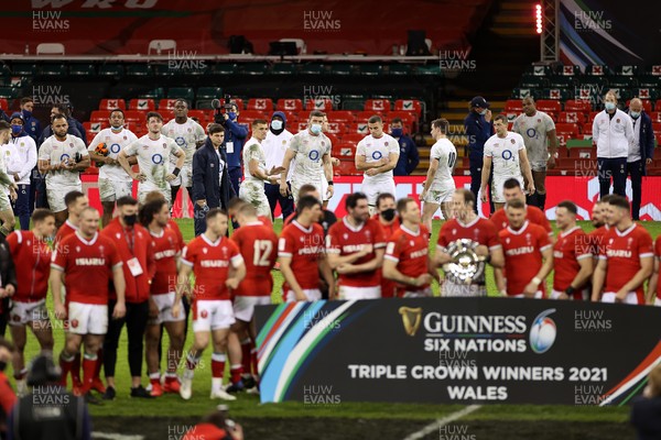 270221 - Wales v England - Guinness 6 Nations - A dejected England look on as Wales lift the Triple Crown