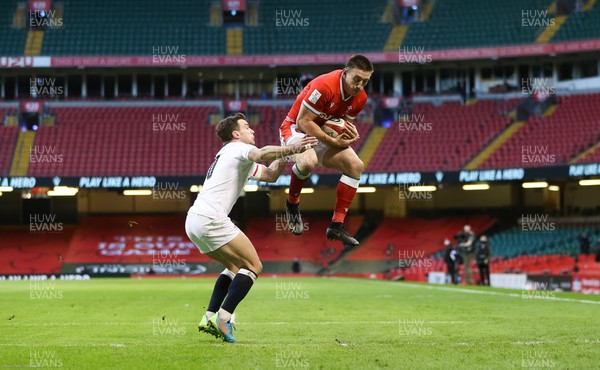 270221 - Wales v England, Guinness 2021 Six Nations Championship - Josh Adams of Wales takes the ball and dives over to score try