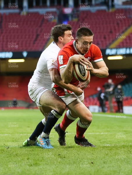 270221 - Wales v England, Guinness 2021 Six Nations Championship - Josh Adams of Wales takes the ball and dives over to score try