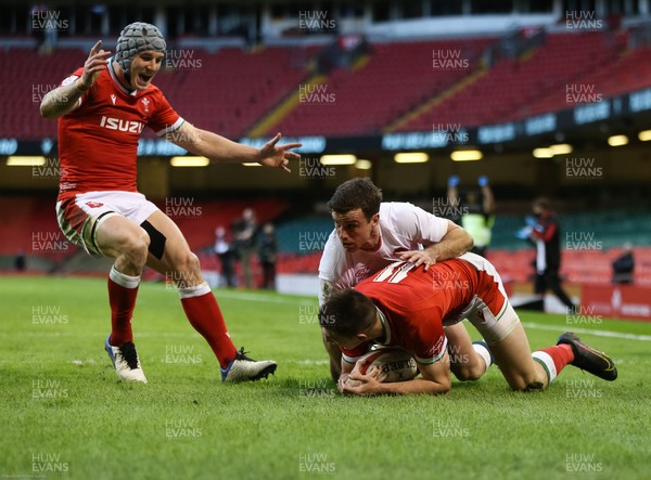 270221 - Wales v England, Guinness 2021 Six Nations Championship - Jonathan Davies of Wales celebrates with Josh Adams of Wales after he takes the ball and dives over to score try