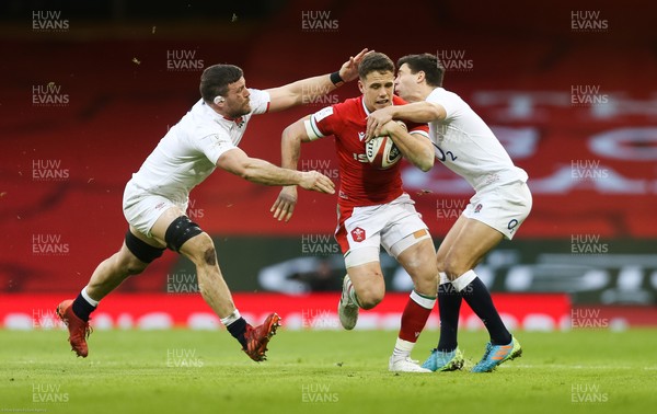 270221 - Wales v England, Guinness 2021 Six Nations Championship - Kieran Hardy of Wales is tackled by Mark Wilson of England and Ben Youngs of England