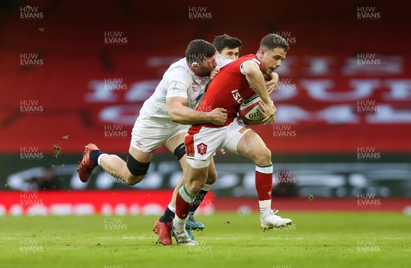 270221 - Wales v England, Guinness 2021 Six Nations Championship - Kieran Hardy of Wales is tackled by Mark Wilson of England and Ben Youngs of England