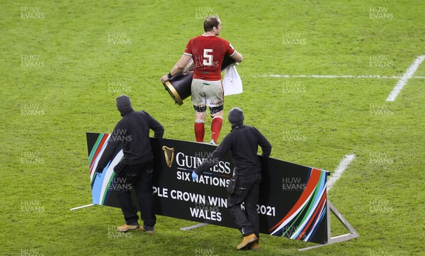270221 - Wales v England, Guinness 2021 Six Nations Championship - Alun Wyn Jones of Wales helps remove the presentation podium from the pitch after being presented with the Triple Crown
