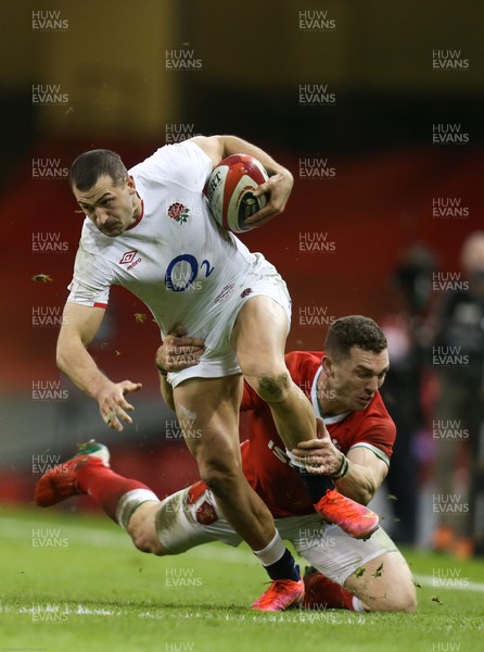 270221 - Wales v England, Guinness 2021 Six Nations Championship - Jonny May of England is tackled by George North of Wales