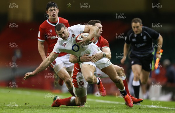 270221 - Wales v England, Guinness 2021 Six Nations Championship - Jonny May of England is tackled by George North of Wales