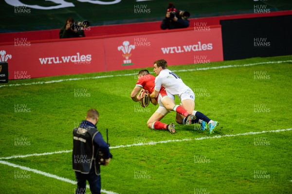270221 - Wales v England - Guinness Six Nations - Josh Adams of Wales scores 