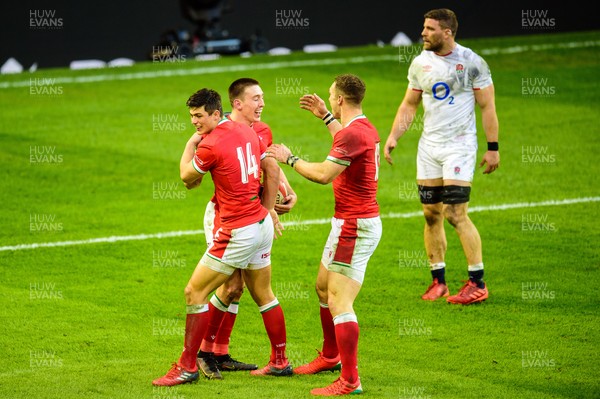 270221 - Wales v England - Guinness Six Nations - Josh Adams of Wales celebrates his try with Louis Rees-Zammit and George North