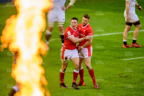 270221 - Wales v England - Guinness Six Nations - Josh Adams of Wales celebrates his try with Dan Biggar