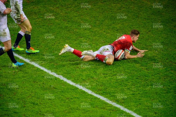 270221 - Wales v England - Guinness Six Nations - Kieran Hardy of Wales  makes break to score a try