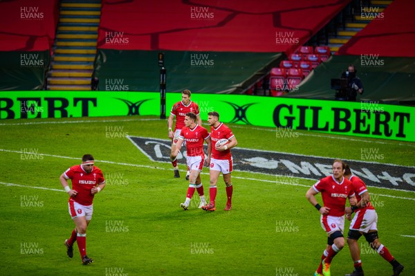 270221 - Wales v England - Guinness Six Nations - Dan Biggar of Wales chats to Kieran Hardy of Wales  after his kick was charged down
