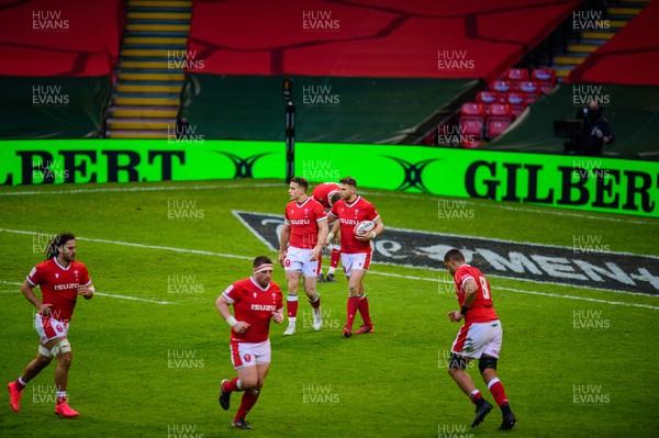 270221 - Wales v England - Guinness Six Nations - Dan Biggar of Wales chats to Kieran Hardy of Wales  after his kick was charged down