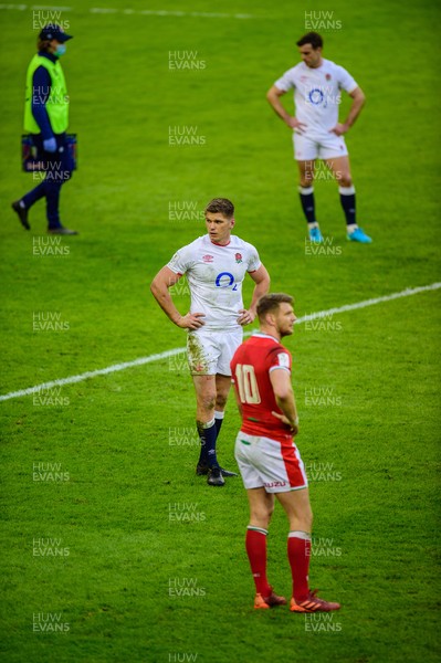 270221 - Wales v England - Guinness Six Nations - Dan Biggar of Wales  and Owen Farrell of England wait for the video replay decision