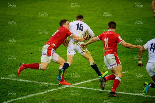 270221 - Wales v England - Guinness Six Nations - Elliot Daly of England  takes on George North of Wales 
