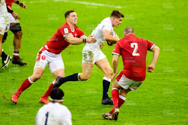 270221 - Wales v England - Guinness Six Nations - George North of Wales  tackles Owen Farrell of England 