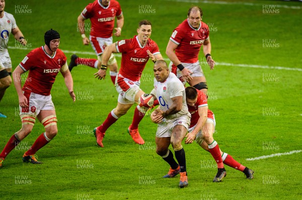 270221 - Wales v England - Guinness Six Nations - Josh Adams of Wales tackles Kyle Sinckler of England 